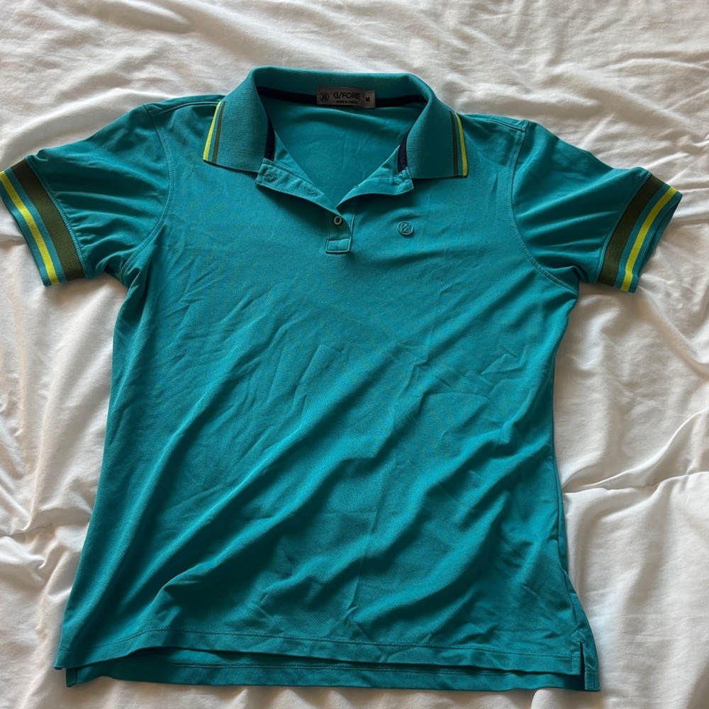 G/FORE Teal Polo Shirt with Navy and Yellow Accents
